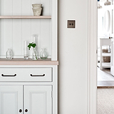 Bronze Sycamore Furniture Handle On Cream Cupboard Furniture Next To Light Switch