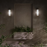 Bank Wall Light Fluted Glass in antique brass, medium wall light with ribbed glass shade, mounted on wall.
