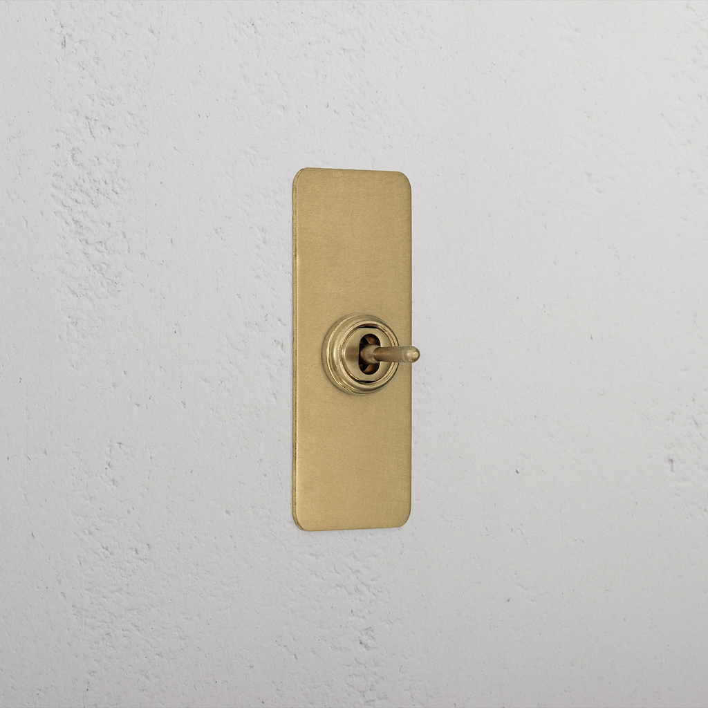 1G Architrave Centre Retractive Toggle Switch - Antique Brass