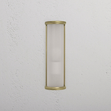 Medium wall light named Bank Wall Light Fluted Glass in antique brass with fluted glass shade on a white wall.