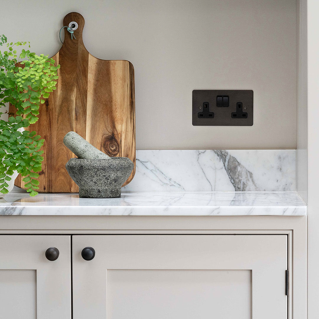 Bronze Designer Double Socket On Marble Kitchen Counter