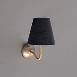 Antique Brass Wall Light with Basalt Grey Linen Shade on Grey Background