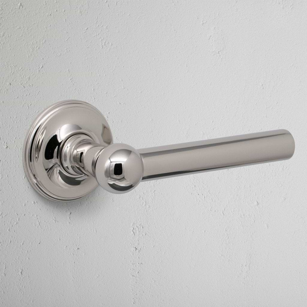 Polished Nickel Harper Unsprung Door Handle On White Background