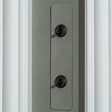 2G Architrave Two Way Toggle Switch in paintable bronze, suitable for switches and dimmers, on a textured panel.