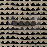 Clear Bronze 4G two way dimmer switch on black and beige scandi wallpapered wall 