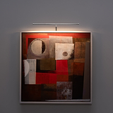 Abstract painting with red, brown, white shapes, illuminated by a 580mm polished nickel Harrow Picture Light.