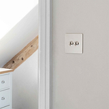 Polished Nickel 2 Gang Toggle Switch On Wall
