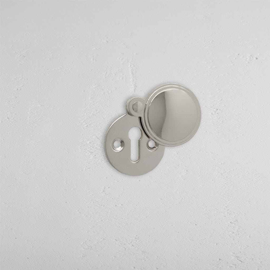 Polished Nickel Warwick Covered Key Escutcheon On White Background