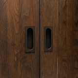 Dark wooden sliding closet doors with sleek bronze Regent Recessed Medium Pull handles.
