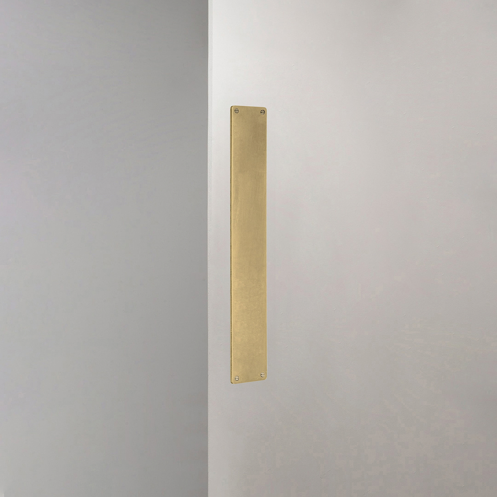 Corston Push Plate In Antique Brass On White Background