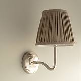 Small Malvern Wall Light in Natural Beige at an angle and affixed to a wall
