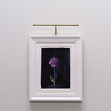 Purple flower painting on dark background, light wall, lit by Harrow Picture Light 400mm in antique brass.