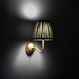Small Malvern Wall Light in Deep Green at an angle and turned on at night