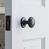 Bronze Poplar Fixed Door Knob on White Wooden Door