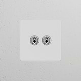 Einfachrahmen mit 2x Kipphebelschalter ─ Lackierbar + Poliertes Nickel