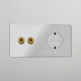Zweifachrahmen mit Kipphebel 2x & SchuKo-Modul in durchsichtigem Messing + Weiß.