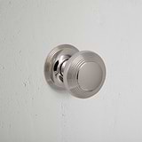 Polished Nickel Poplar Fixed Door Knob on White Background