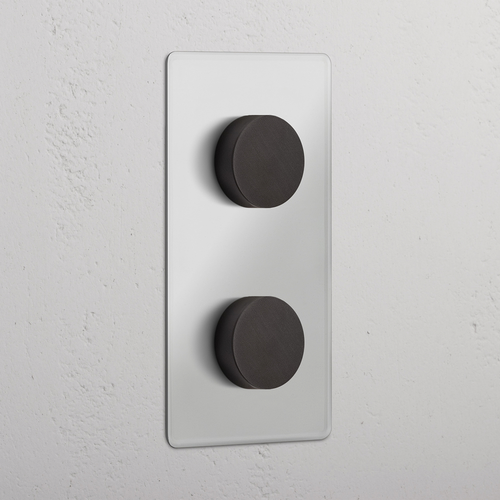 2x Multicontrol Dimschakelaar (Dubbele Verticale Afdekplaat) in doorzichtig brons met twee ronde knoppen.