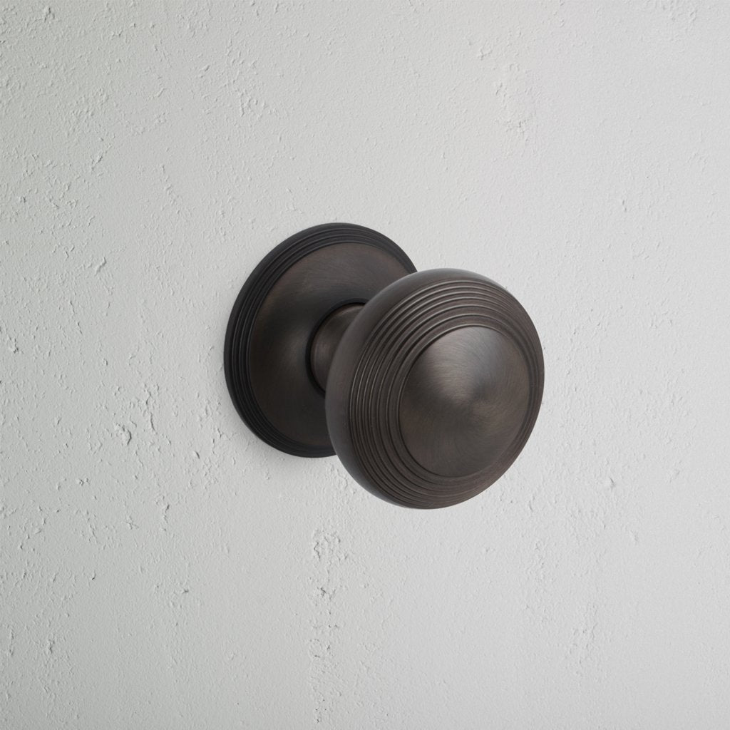 Bronze Poplar Fixed Sprung Knob on White Background