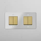 Dubbele tuimelschakelaar met vier posities in doorzichtig Antiek Messing wit - moderne verlichtingsbediening op witte achtergrond