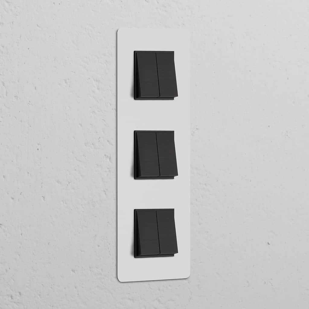 Vertikaler Dreifachrahmen mit 6x Wippschalter in Bronze und Schwarz, lackierbar, für elegante Steuerung.