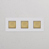 Dreifachrahmen mit 3x Wippschalter in antikem Messing und Weiß, lackierbar; passend für Schalter und Dimmer.