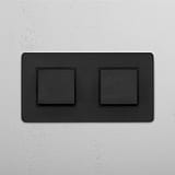 Wippschalter mit zwei Positionen – Bronze + Schwarz – moderner Schalter – auf weissem Hintergrund