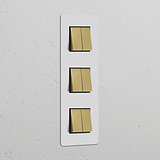 Vertikaler Dreifachrahmen mit 6x Wippschalter, lackierbar in antikem Messing und Schwarz, für Schalter und Dimmer.