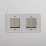 Doppel-Wippschalter mit vier Positionen – Durchsichtig + Poliertes Nickel + Weiss – Einstellbares Lichtmanagement – auf weissem Hintergrund