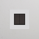 Wippschalter 2x im Einfachrahmen – lackierbare, bronzefarbene und schwarze Schalter mit Dimmer vor weißem Hintergrund.