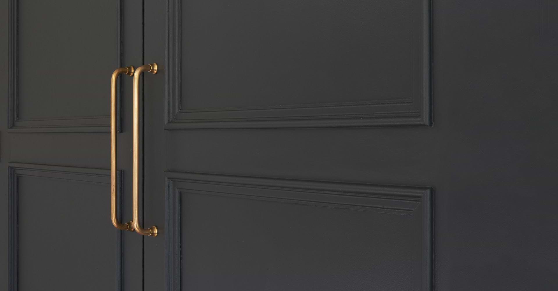 Antique Brass poplar mortice door knob on black door