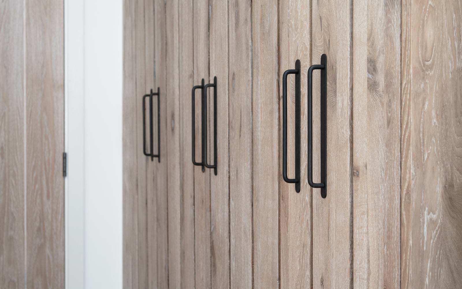 Corston bronze kilburn furniture handle on wooden slated doors