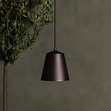 Richmond Medium Pendant Light in bronze finish with a sleek design, hanging elegantly against a blurred background.