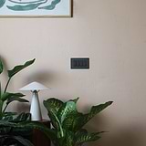 Bronze black 4G two-way rocker switch mounted on a wall, suitable for 4G switches & dimmers.