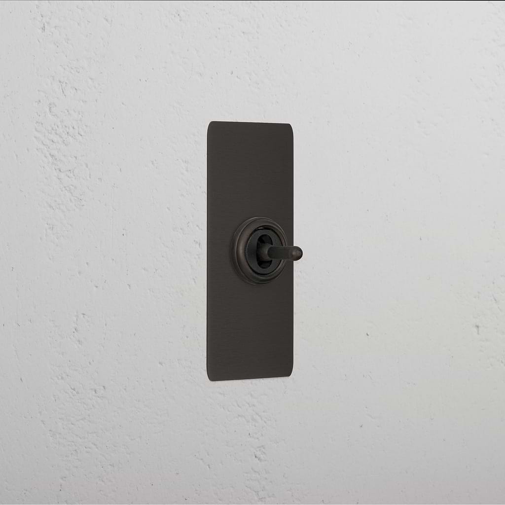 1G Architrave Centre Retractive Toggle Switch - Bronze
