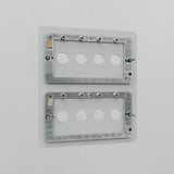 Clear 8G switch plate on a white wall, designed for secure mounting and seamless integration.