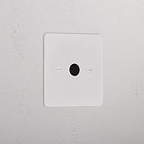 Flex Outlet - Paintable Black 1G Socket with a central black button on a white wall plate.