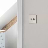 Polished Nickel 2 Gang Toggle Switch On Wall