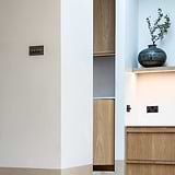 A bronze 4G two-way dimmer switch on a cream wall, part of the 4G Switches & Dimmers collection.
