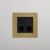 Antique brass black 2x CAT6 socket on a beige square panel, mounted on a textured white wall.