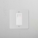 Paintable white BT slave socket on a textured gray wall, designed for 1G sockets & modules.