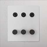 '6G Mixed Switch 3T3D - Paintable Bronze' with three black switches and three knobs, suitable for 6G Switches & Dimmers.