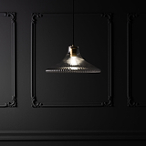 Hammersmith Large Pendant Light with fluted glass and antique brass finish hanging elegantly in a stylish room.