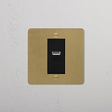 Antique brass black 1G USB A+C socket with a minimalist design on a gold-colored plate.