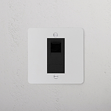 Paintable black CAT6 socket from the 1G Sockets & Modules range, installed on a white wall.