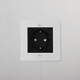 Paintable Black Schuko Socket, 1G Sockets & Modules on white wall for customizable home electrical solutions.