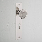 Poplar Sprung Door Knob & Euro Lock on Long Plate, Polished Nickel—stylish and functional on any door.