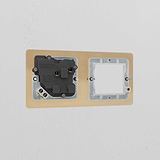 Antique Brass Black 1G 50mm Module & Single Socket UK Plate on wall, part of Brass Module Plates - Black series.