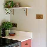 shelf bracket with double socket on 3g toggle on wall