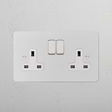 Paintable white double socket with switches for UK use, fits 2G Sockets & Modules, customizable to match décor.